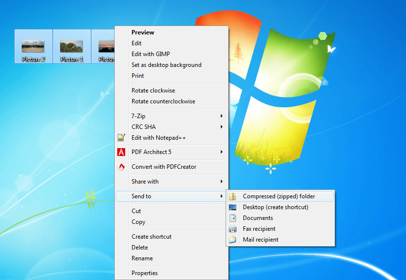 Captura de pantalla del escritorio de Windows en el que se procede a comprimir diferentes archivos separados en una sola carpeta